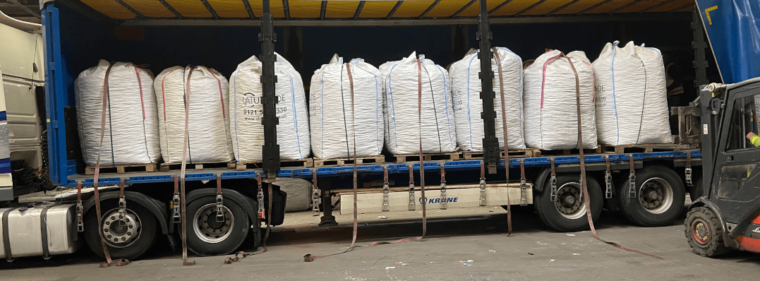 Lorry, shown with its side open containing aluminium products